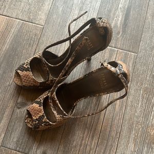 H
Label as Stuart Weitzman, size 7.5 Brown Snake skin, peep toe, stiletto at
